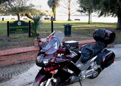 Motorcycle parked in front of lakeside park (c) 2010 Ted Grellner Motorcycle parked in front of lakeside park (c) 2010 Ted Grellner