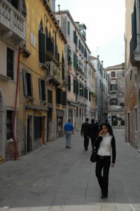 Communication by Cell Phone is indispensable now / Venetian Girl on Cell Phone(c) 2007 Ted Grellner Communication by Cell Phone is indispensible now / Venetian Girl on Cell Phone(c) 2007 Ted Grellner